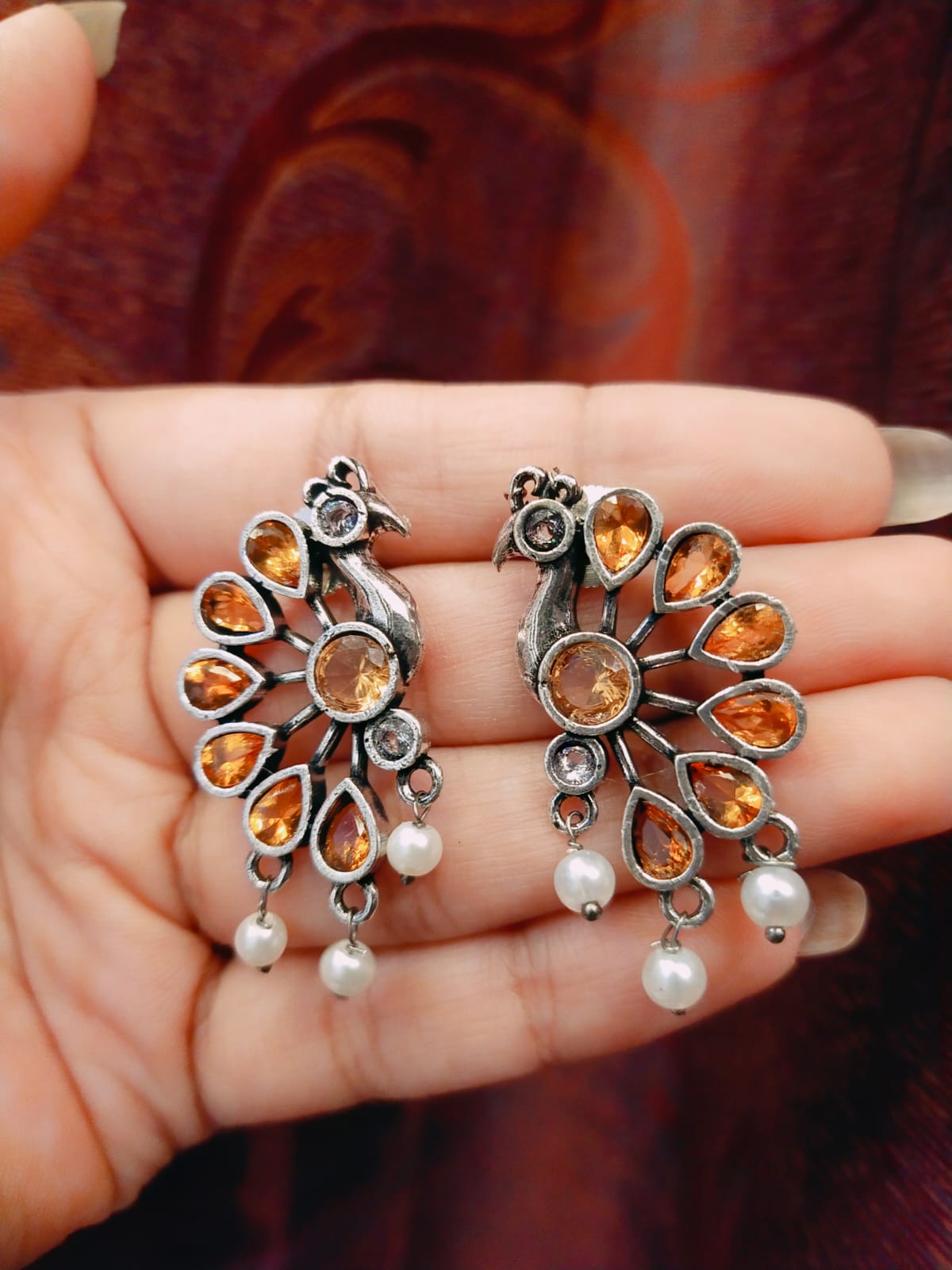 Peacock motif earring
