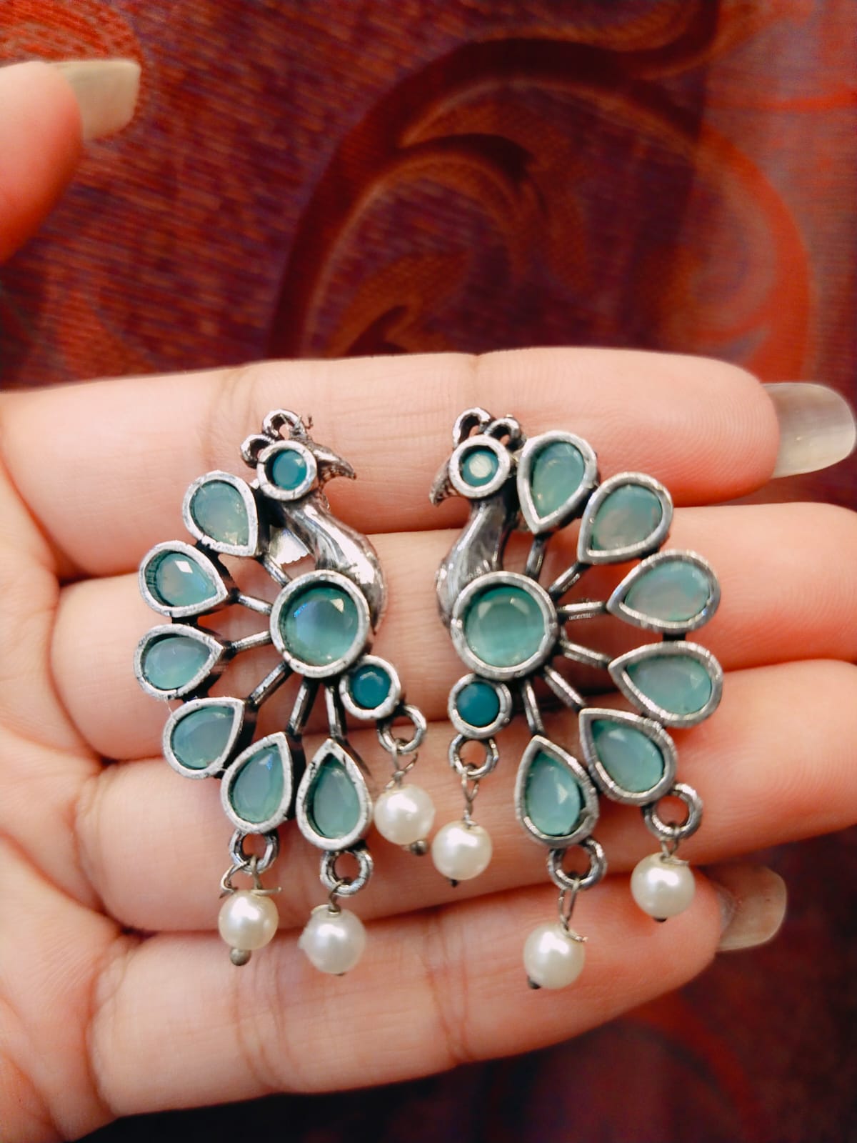 Peacock motif earring