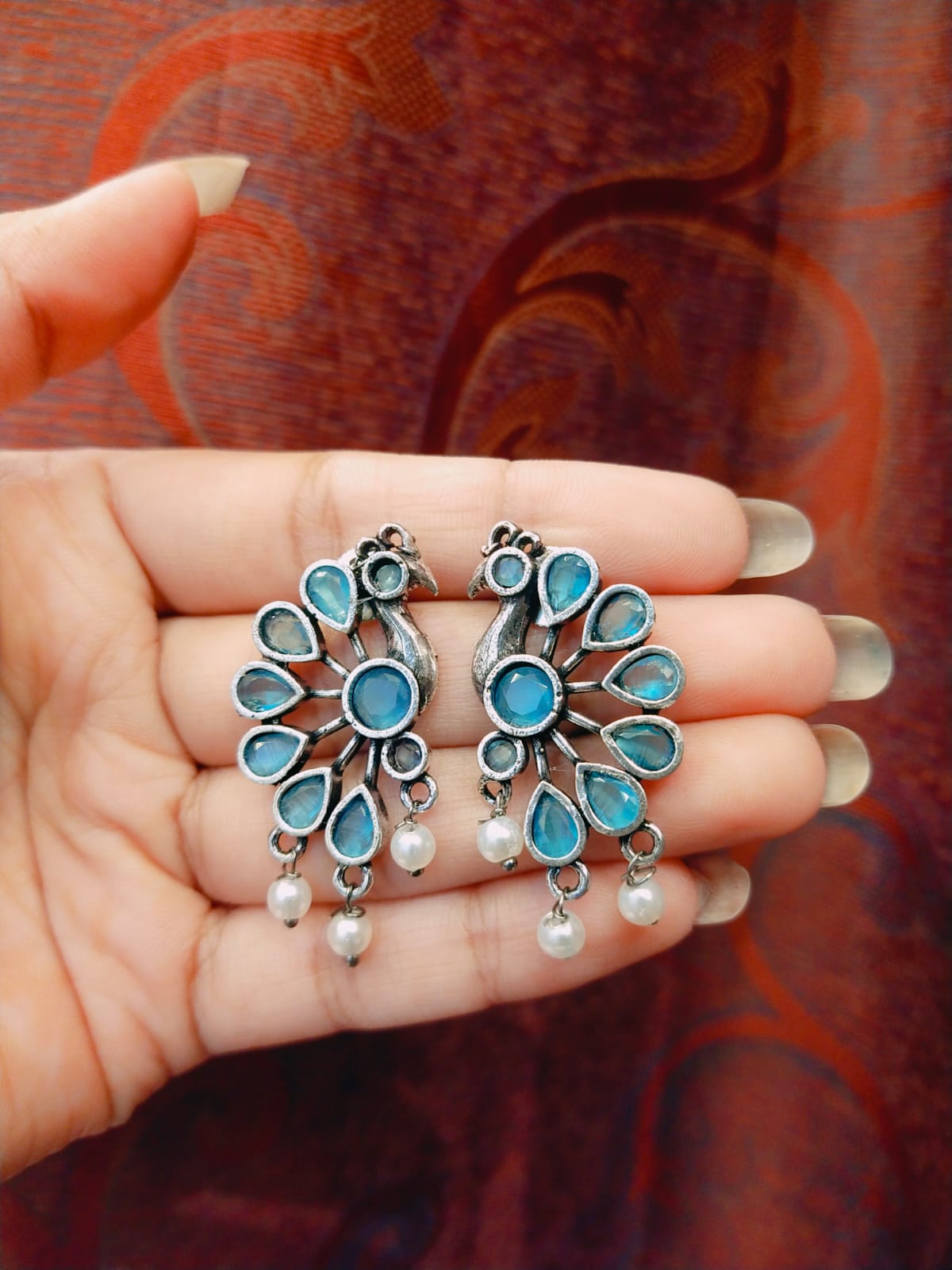 Peacock motif earring