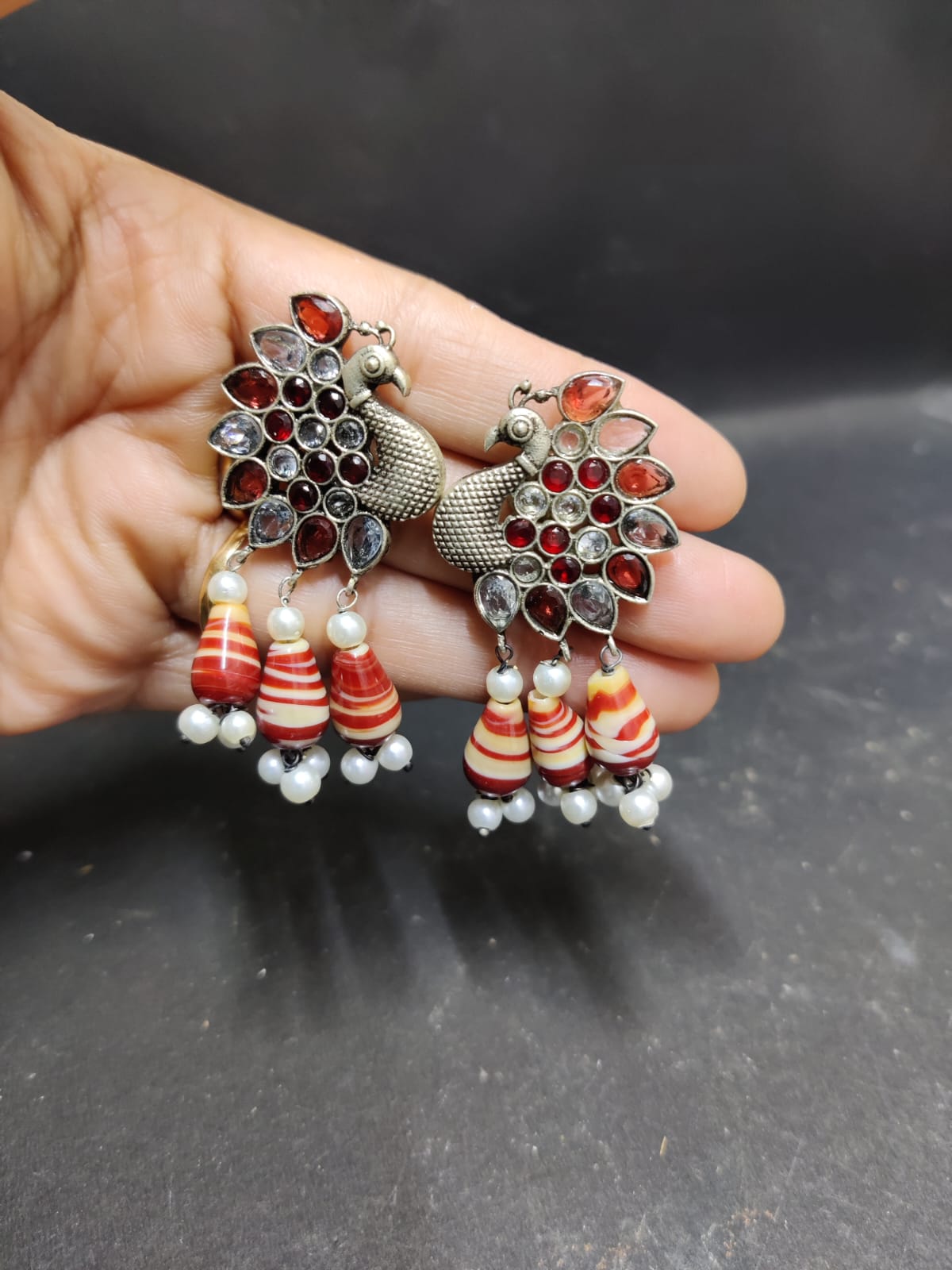 Peacock motif brass studs